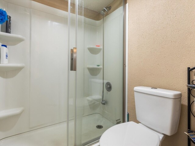 1505 Ward Rd Unit 215, Baytown, TX 77520 - full bath featuring a stall shower and toilet
