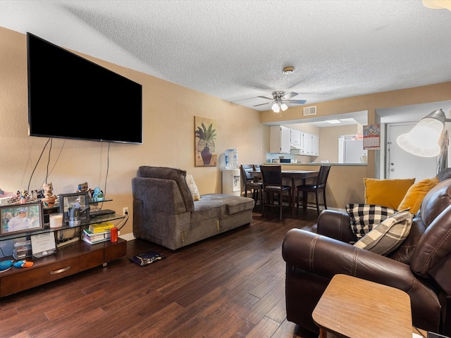 1505 Ward Rd Unit 215, Baytown, TX 77520 - living area with ceiling fan, a textured ceiling, and wood finished floors