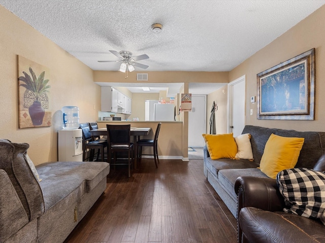 1505 Ward Rd Unit 215, Baytown, TX 77520 - living area featuring a ceiling fan, dark wood-style floors, and a textured ceiling