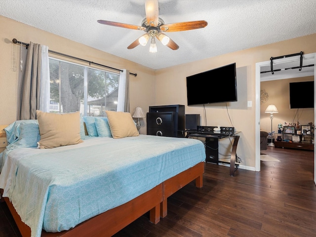 1505 Ward Rd Unit 215, Baytown, TX 77520 - bedroom featuring wood finished floors, a textured ceiling, and a ceiling fan