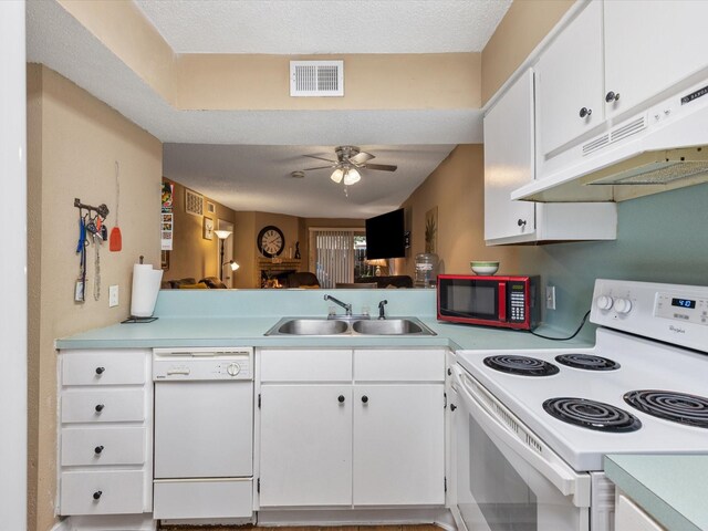 1505 Ward Rd Unit 215, Baytown, TX 77520 - kitchen featuring white appliances, under cabinet range hood, light countertops, a ceiling fan, and white cabinets