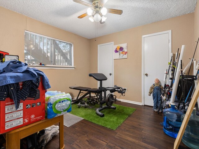 1505 Ward Rd Unit 215, Baytown, TX 77520 - workout room with wood finished floors, a textured ceiling, and a ceiling fan