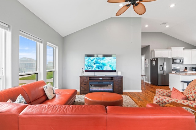 18607 Warrior Rd, Galveston, TX 77554 - living room with wood finished floors, ceiling fan, high vaulted ceiling, and recessed lighting