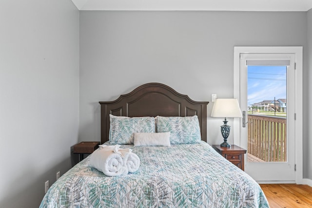 18607 Warrior Rd, Galveston, TX 77554 - bedroom with wood finished floors and baseboards