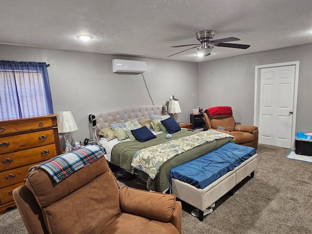 518 Bowie St, Liberty, TX 77575 - bedroom with a wall unit AC, carpet, a ceiling fan, and a textured ceiling