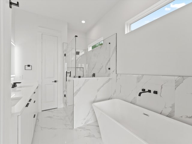 1604 Mary St, Houston, TX 77026 - full bathroom featuring a marble finish shower, a freestanding bath, marble finish flooring, double vanity, and recessed lighting