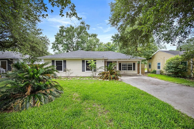 4535 Clermont Ave, Groves, TX 77619 - view of front of home featuring driveway and a front lawn