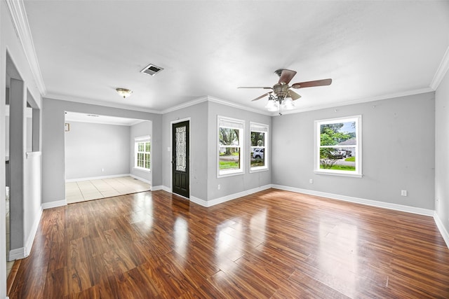 4535 Clermont Ave, Groves, TX 77619 - spare room with ceiling fan, ornamental molding, and wood finished floors