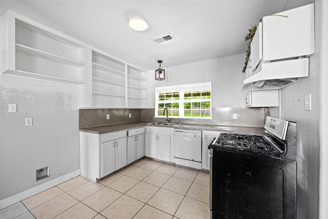 4535 Clermont Ave, Groves, TX 77619 - kitchen featuring white dishwasher, stainless steel range with gas stovetop, light tile patterned floors, and open shelves