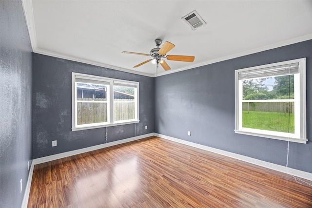 4535 Clermont Ave, Groves, TX 77619 - spare room featuring crown molding, wood finished floors, and a ceiling fan