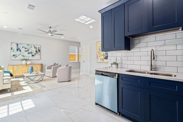 9315 Noel St, Houston, TX 77033 - kitchen with dishwasher, blue cabinetry, ceiling fan, decorative backsplash, and recessed lighting