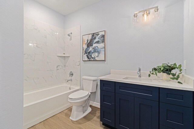 9315 Noel St, Houston, TX 77033 - full bath featuring vanity, wood finished floors, and tub / shower combination