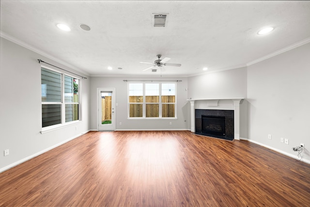 1517 Asbury St, Houston, TX 77007 - unfurnished living room with ornamental molding, recessed lighting, ceiling fan, wood finished floors, and a fireplace