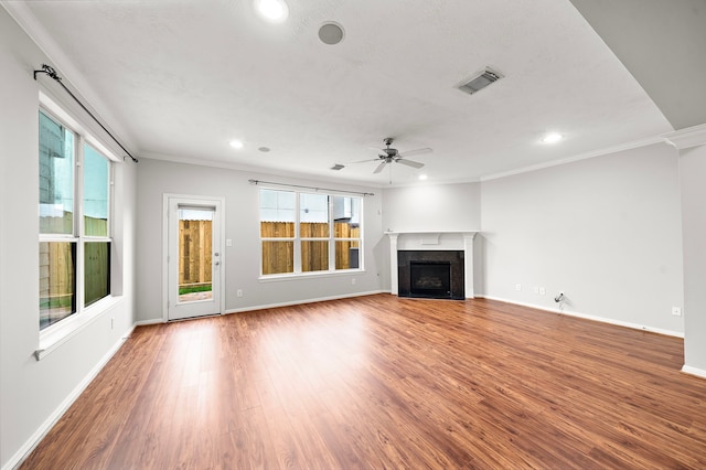 1517 Asbury St, Houston, TX 77007 - unfurnished living room with ceiling fan, recessed lighting, healthy amount of natural light, a fireplace with flush hearth, and wood finished floors