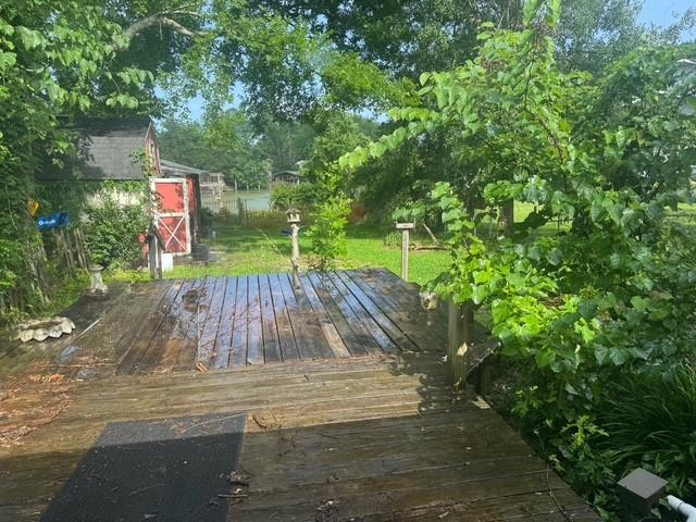 771 Governor Wood Dr, Point Blank, TX 77364 - wooden deck with a shed