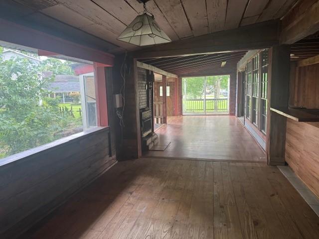 771 Governor Wood Dr, Point Blank, TX 77364 - corridor with hardwood / wood-style floors, plenty of natural light, wood ceiling, and wood walls