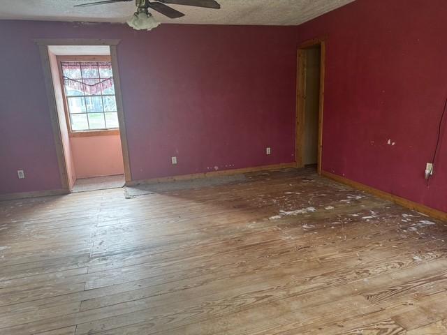 771 Governor Wood Dr, Point Blank, TX 77364 - spare room featuring ceiling fan, hardwood / wood-style flooring, and a textured ceiling