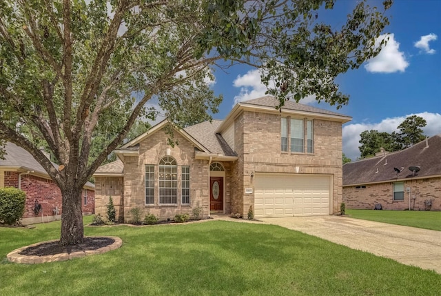 71 N Merryweather Cir, Conroe, TX 77384 - traditional-style home with a garage, roof with shingles, brick siding, a front yard, and driveway