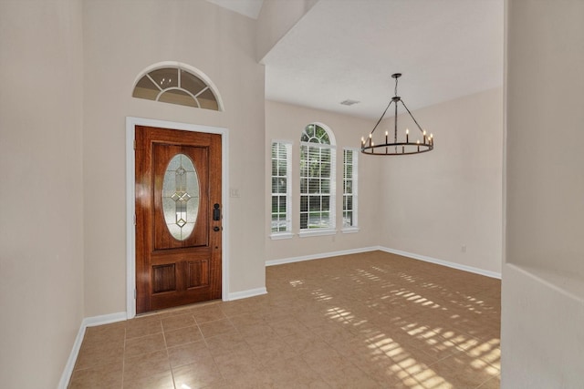 71 N Merryweather Cir, Conroe, TX 77384 - tiled entrance foyer with a chandelier and baseboards