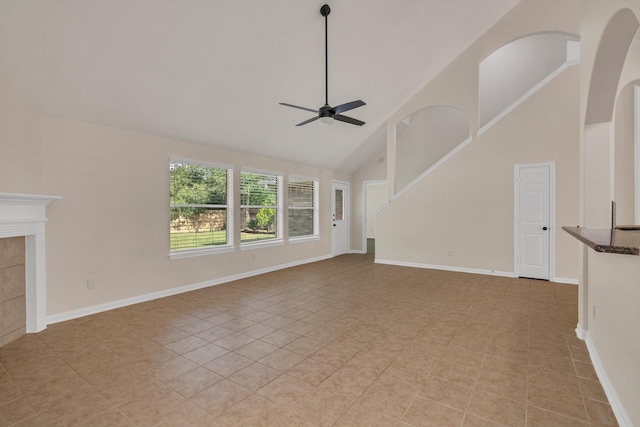 71 N Merryweather Cir, Conroe, TX 77384 - unfurnished living room with ceiling fan, high vaulted ceiling, and light tile patterned floors