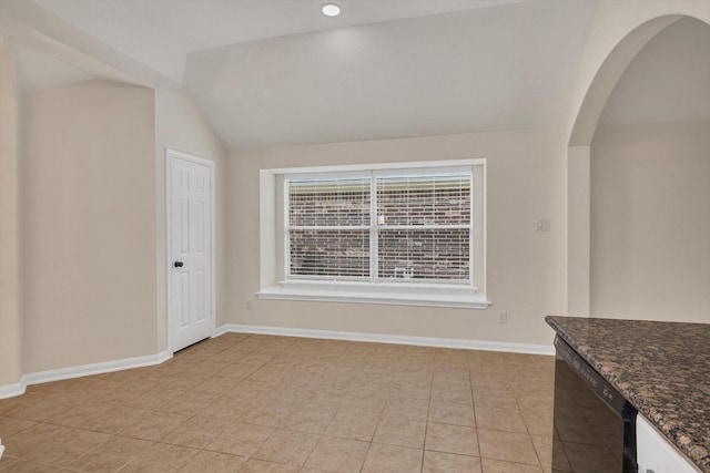 71 N Merryweather Cir, Conroe, TX 77384 - unfurnished dining area with lofted ceiling, arched walkways, and light tile patterned floors