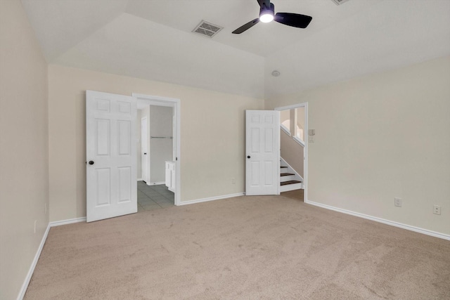 71 N Merryweather Cir, Conroe, TX 77384 - unfurnished bedroom featuring carpet flooring, lofted ceiling, and ceiling fan