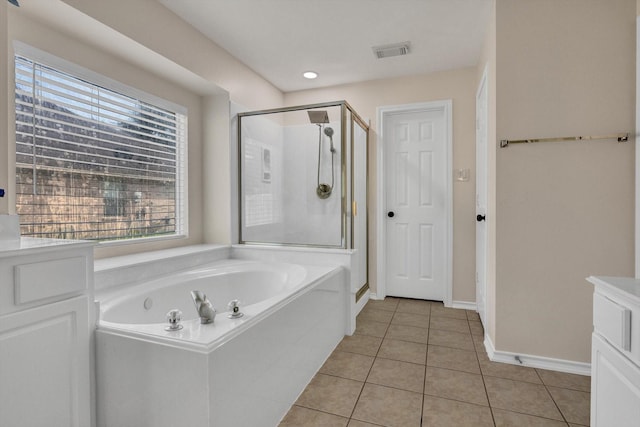 71 N Merryweather Cir, Conroe, TX 77384 - full bathroom featuring a shower stall, a bath, tile patterned flooring, and recessed lighting