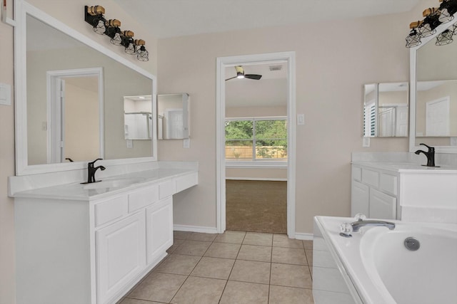 71 N Merryweather Cir, Conroe, TX 77384 - full bath with two vanities, a bath, and tile patterned flooring