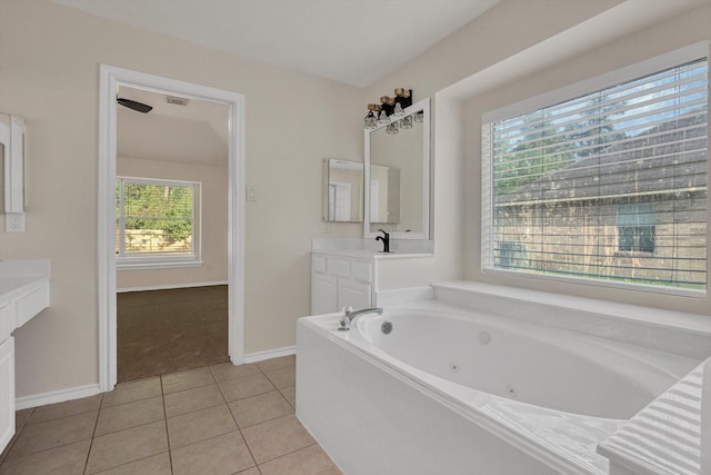 71 N Merryweather Cir, Conroe, TX 77384 - full bath with vanity, a jetted tub, and tile patterned flooring