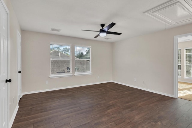 71 N Merryweather Cir, Conroe, TX 77384 - spare room with attic access, dark wood-style flooring, plenty of natural light, and a ceiling fan