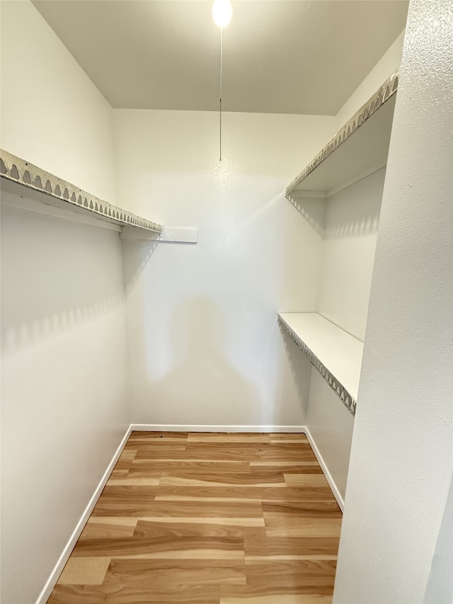 7040 Jetty Ln, Houston, TX 77072 - spacious closet with light wood-type flooring