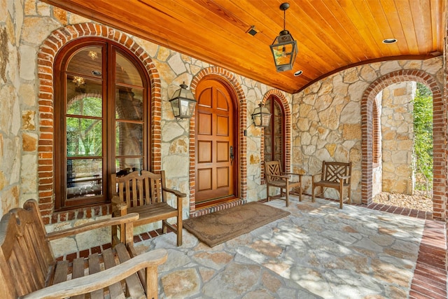 603 W Friar Tuck Ln, Houston, TX 77024 - entrance to property featuring stone siding and a porch