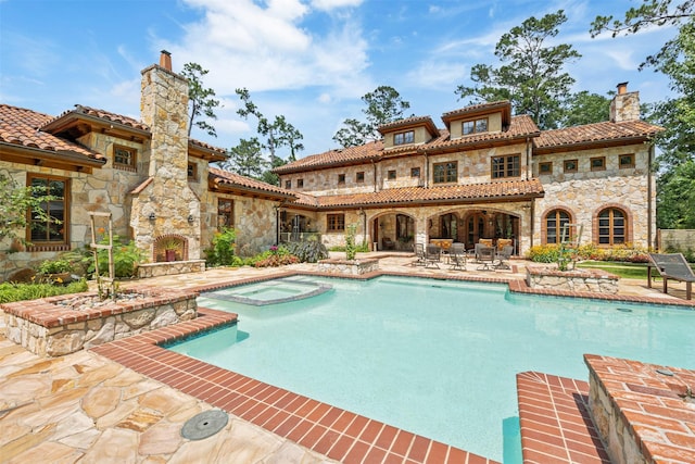 603 W Friar Tuck Ln, Houston, TX 77024 - view of pool with a fireplace, a patio, and a pool with connected hot tub