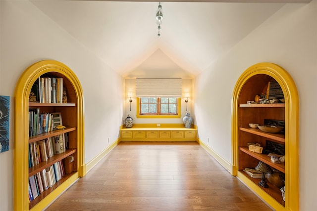 603 W Friar Tuck Ln, Houston, TX 77024 - hallway featuring light wood-type flooring, lofted ceiling, and built in features