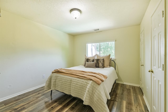 227 Fairwind Trail Dr, The Woodlands, TX 77385 - bedroom with wood finished floors and baseboards
