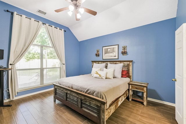 227 Fairwind Trail Dr, The Woodlands, TX 77385 - bedroom featuring vaulted ceiling, wood finished floors, and a ceiling fan