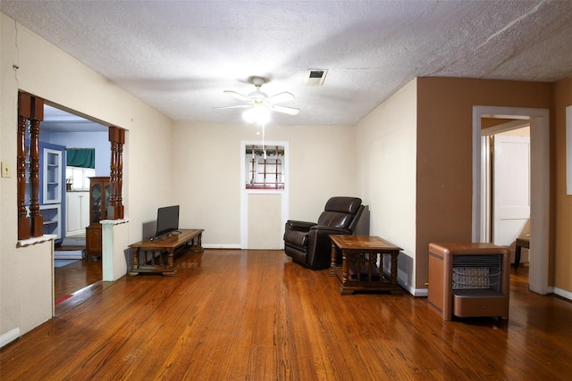 3614 Billingsley St, Houston, TX 77009 - sitting room with wood finished floors, a ceiling fan, and a textured ceiling