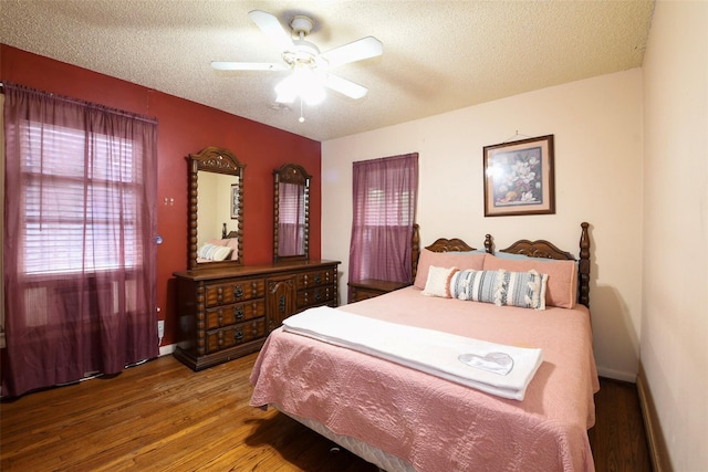 3614 Billingsley St, Houston, TX 77009 - bedroom featuring wood finished floors, a textured ceiling, and ceiling fan