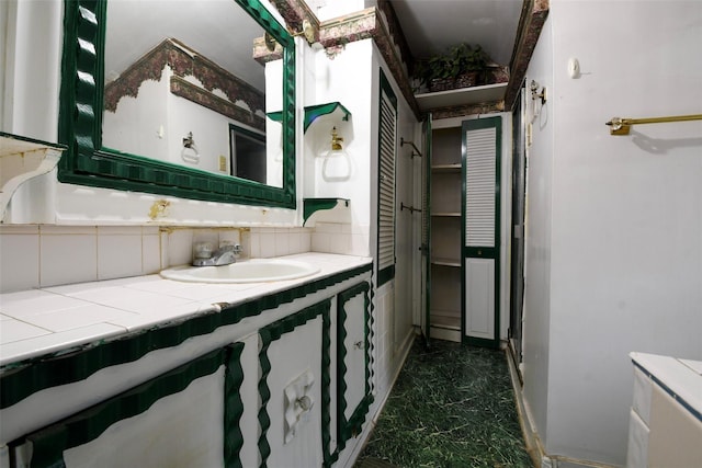 3614 Billingsley St, Houston, TX 77009 - bathroom featuring a closet, marble look tile flooring, and vanity