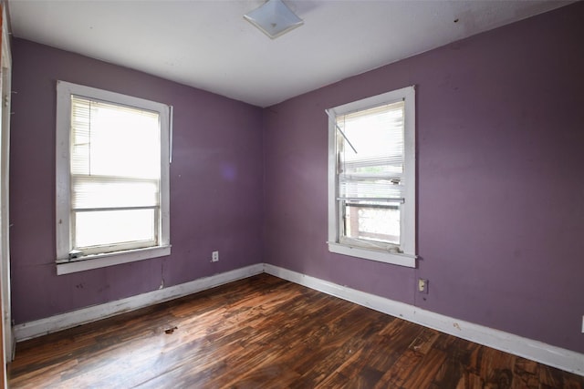 3614 Billingsley St, Houston, TX 77009 - spare room with dark wood-style floors and baseboards