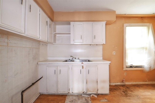 3614 Billingsley St, Houston, TX 77009 - kitchen featuring open shelves, white cabinets, light countertops, and light wood-type flooring