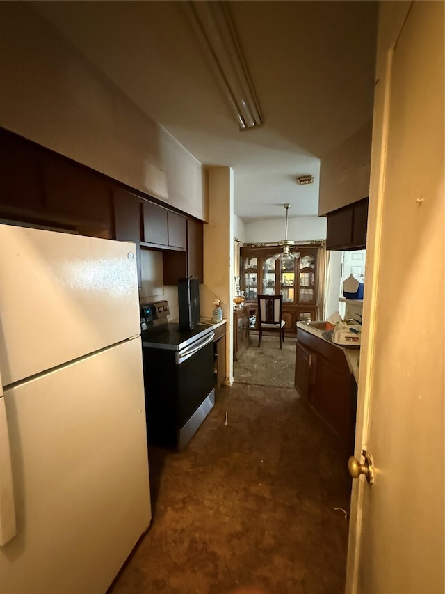 12380 Sandpiper Dr Unit 201, Houston, TX 77035 - kitchen featuring freestanding refrigerator, electric range, dark brown cabinetry, and decorative light fixtures
