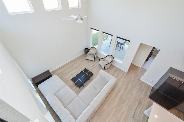 9522 Rialto Creek Dr, Cypress, TX 77433 - living room with a towering ceiling, light wood-type flooring, and ceiling fan