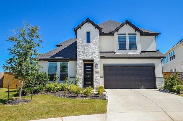 9522 Rialto Creek Dr, Cypress, TX 77433 - view of front of house with stucco siding, an attached garage, stone siding, concrete driveway, and roof with shingles