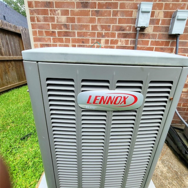 110 Greenridge Cir, League City, TX 77573 - exterior view of brick siding and a central air condition unit