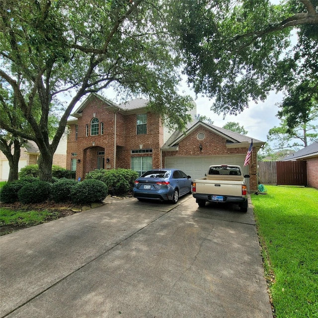 110 Greenridge Cir, League City, TX 77573 - traditional home with driveway, brick siding, and a garage