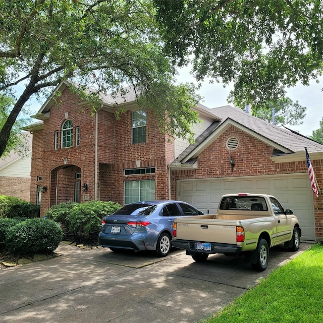 110 Greenridge Cir, League City, TX 77573 - traditional-style house featuring driveway, a garage, and brick siding