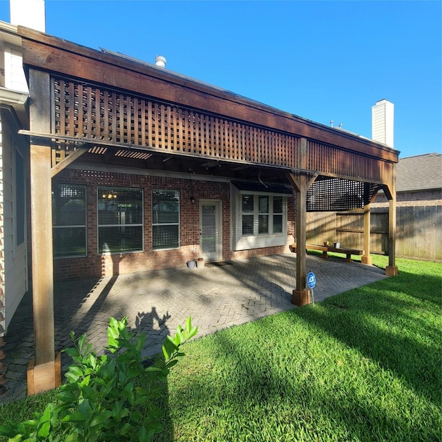 110 Greenridge Cir, League City, TX 77573 - rear view of house featuring a patio and brick siding