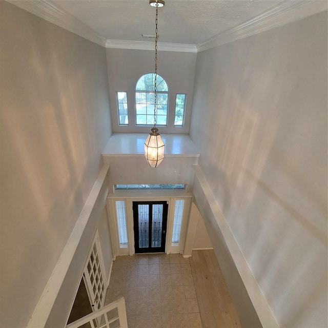 110 Greenridge Cir, League City, TX 77573 - entrance foyer with a chandelier and ornamental molding