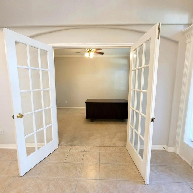 110 Greenridge Cir, League City, TX 77573 - hallway featuring french doors, carpet floors, tile patterned floors, and ornamental molding